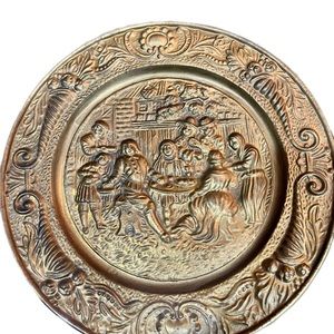 Hammered brass plate for wall made in England.